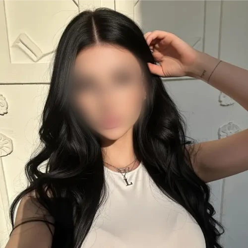 Woman taking a selfie with her face blurred