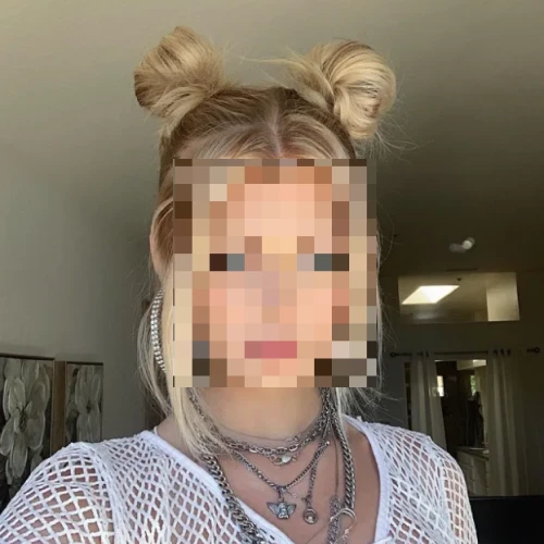 Woman with space buns and her face pixelated